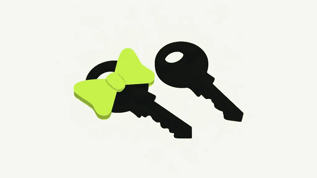 Two dark charcoal keys lying side by side on a pale cool grey background, the left one with a bright lime ribbon bow tied around its head